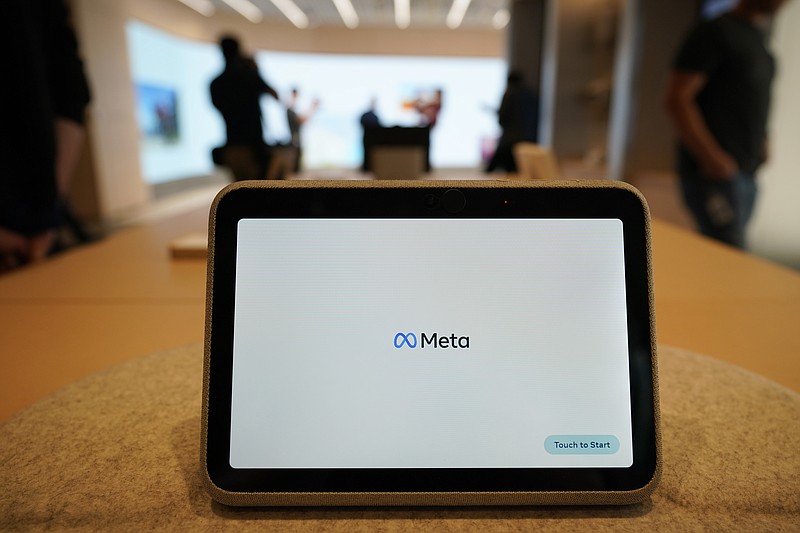 A Meta Portal Go is displayed during a preview of the Meta Store on Wednesday, May 4, 2022, in Burlingame, Calif. Facebook and Instagram’s parent company Meta posted its first revenue decline in history on Thursday, July 27, 2022, dragged by a drop in ad spending as the economy falters — and as competition from rival TikTok intensifies. (AP Photo/Eric Risberg)