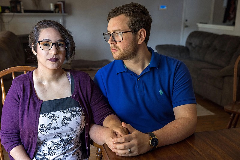 Elizabeth and James Weller are seen at their home in Houston two months after losing their unborn daughter to a premature rupture of membranes. Elizabeth could not receive the medical care she needed until several days later because of a Texas law that banned abortion after six weeks. (Julia Robinson/NPR/KHN)