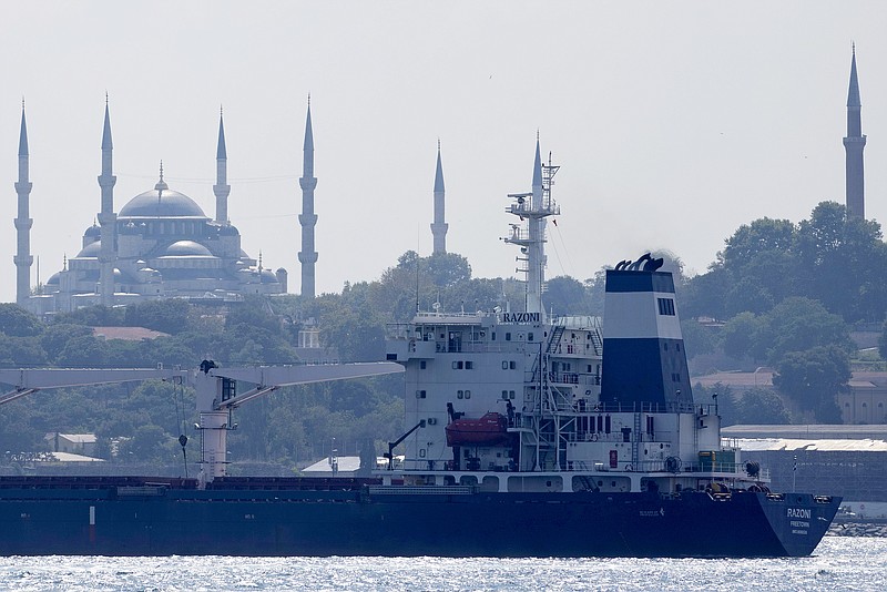 The cargo ship Razoni crosses the Bosphorus Strait in Istanbul, Turkey, Wednesday, Aug. 3, 2022. The first cargo ship to leave Ukraine since the Russian invasion was anchored at an inspection area in the Black Sea off the coast of Istanbul Wednesday morning, awaiting an inspection, before moving on to Lebanon. (AP Photo/Khalil Hamra)