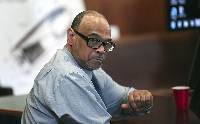 FILE - In this May 30, 2018, photo, Shaun Harrison reacts as attorneys give closing arguments in his trial in Suffolk Superior Court in Boston.  Harrison, a former dean at a Boston high school known affectionately by students as “Rev” has been ordered, Friday, Aug. 5, 2022 by a federal judge to pay more than $10 million in damages to a former student he was convicted of trying to kill in a dispute over drug sales.(Pat Greenhouse/The Boston Globe via AP)