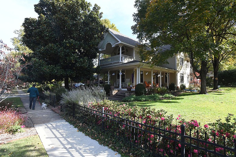 The Norman house, a Queen Anne-influenced style home constructed in 1880 with a large wrap-around porch is seen Oct. 23, 2019, at 502 N. Washington Ave., in Fayetteville. The City Council has approved a contract with a consultant to develop a citywide heritage and historic preservation master plan. (File photo/NWA Democrat-Gazette/J.T. Wampler)