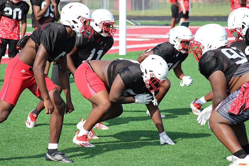 Photo By: Michael Hanich
Camden Fairview tackle Khaleb Smith gets set to attack the offensive line in a drill.