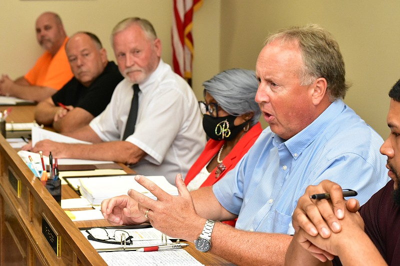 Watson Chapel School Board member Alan Frazier, foreground, discusses the millage increase request during a board meeting Monday. Pictured from left: board members Kevin Moore and Mack Milner, Superintendent Tom Wilson, board President Sandra Boone and board member Christopher Dutton. (Pine Bluff Commercial/I.C. Murrell)