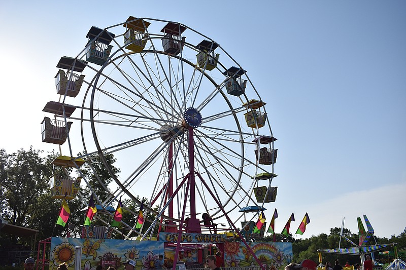 An empty Ferris wheel is seen Saturday (Aug. 6, 2022,) while loading at the Moniteau County Fair on the Moniteau County Fairgrounds in California, Missouri. A variety of carnival rides were on site throughout the week. (Democrat photo/Garrett Fuller)