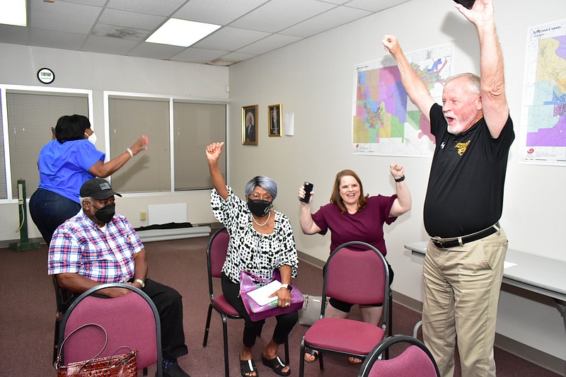 Watson Chapel School District supporters celebrate the passage of a 5.7-mill increase Tuesday at the Jefferson County Election Commission office in downtown Pine Bluff. Pictured from left: district board member Goldie Whitaker, Walter Boone, board President Sandra Boone, district treasurer Norma Walker and Superintendent Tom Wilson. (Pine Bluff Commercial/I.C. Murrell)