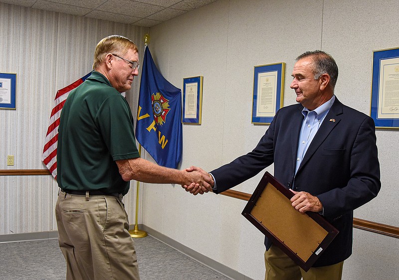 Missouri Lt. Gov. Mike Kehoe, right, congratulates Don Hentges as he presents Hentges with the  Lt. Governor’s Senior Service Award Wednesday, Aug. 10, 2022, during a brief ceremony at the State VFW Headquarters where Hentges serves as  adjutant. Hentges was nominated for the recognition by Sen. Mike Bernskoetter, who also was in attendance. (Julie Smith/News Tribune photo)