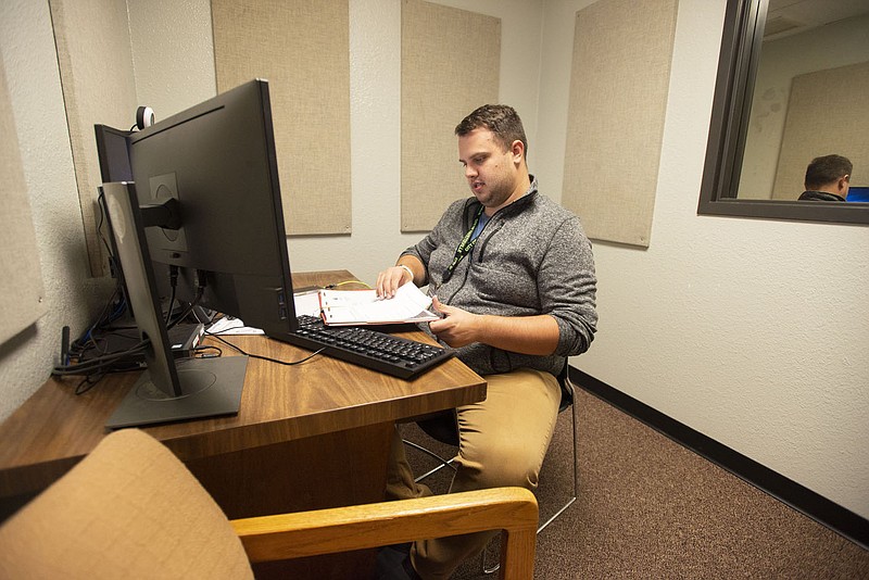 Steven Greathouse works Nov. 24, 2021, at the Fayetteville police station. Greathouse is a social worker on the department’s crisis intervention team. The city’s Board of Health heard a presentation from the team during its Wednesday meeting.

(File photo/NWA Democrat-Gazette/J.T. Wampler)