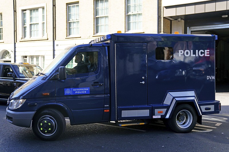 A prison van believed to be carrying Aine Davis arrives at Westminster Magistrates' Court, central London, Thursday Aug. 11, 2022. Davis, an alleged member of an Islamic State hostage-taking cell nicknamed “The Beatles” has been charged with terrorism offenses in Britain on Thursday after being deported from Turkey. London police say Aine Davis was arrested at Luton Airport north of London on Wednesday night and charged with offenses under the Terrorism Act. (Victoria Jones/PA via AP)