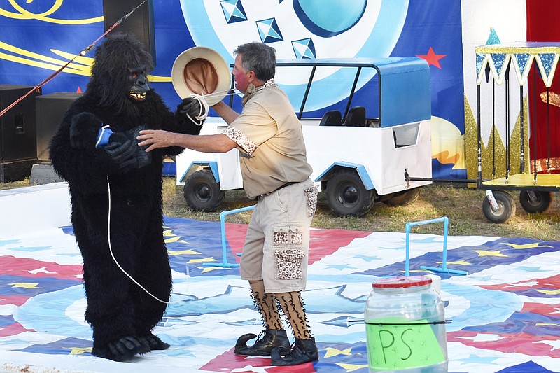 A clown with Los Moralitos Circus confronts a "gorilla" Aug. 1, 2022, in Sappington Arena at the Moniteau County Fair in California. (Democrat photo/Garrett Fuller)