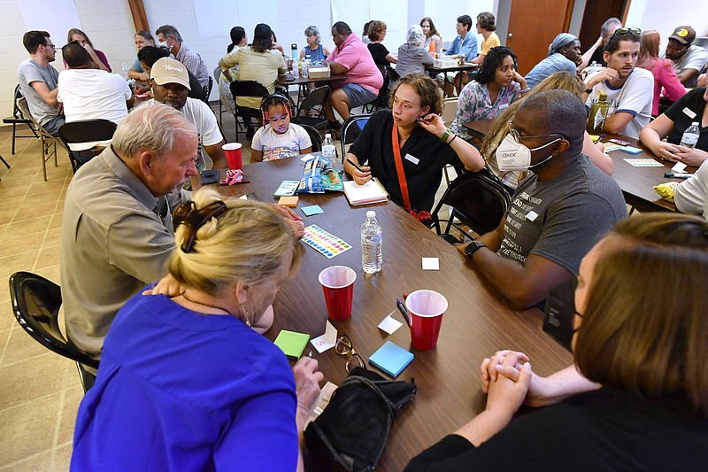 Residents record a list of ideas Friday during a community workshop organized by the Arkansas Justice Reform Coalition at St. James Missionary Baptist Church in Fayetteville. The event, called "Build Community, Not Jails," was held to explore alternatives to county jail expansion plans. Visit nwaonline.com/220813Daily/ for today’s photo gallery.

(NWA Democrat-Gazette/Andy Shupe)