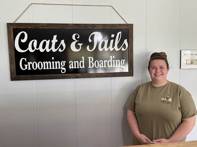 Coats and Tails Grooming owner Charlie Brauner proudly announces her business will be expanding boarding services for clients and their pets. (Democrat photo/Kaden Quinn)