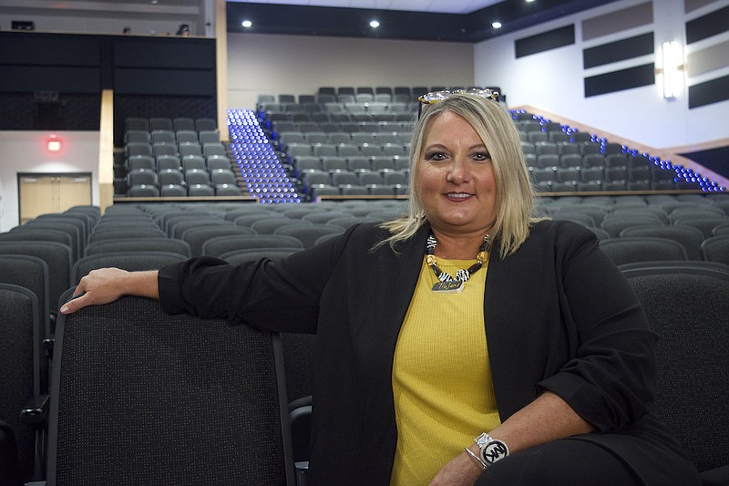 Cherri Mertz, better known as "Mama Mertz," sits inside the performing arts auditorium at Hot Springs Junior Academy. - Photo by Donald Cross