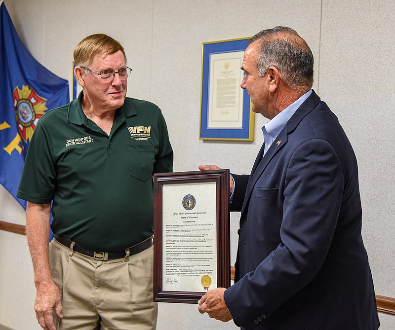 Missouri Lt. Gov. Mike Kehoe, right,  presents Don Hentges with the  Lt. Governor’s Senior Service Award Wednesday, Aug.10, 2022, during a brief ceremony at the State VFW Headquarters where Hentges serves as  adjutant. Hentges was nominated for the recognition by Sen. Mike Bernskoetter, who also was in attendance. (Julie Smith/News Tribune photo)