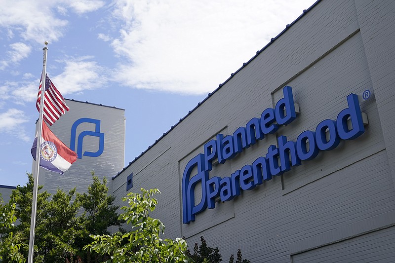 FILE - Missouri and American flags fly outside Planned Parenthood June 24, 2022, in St. Louis. (AP Photo/Jeff Roberson, File)