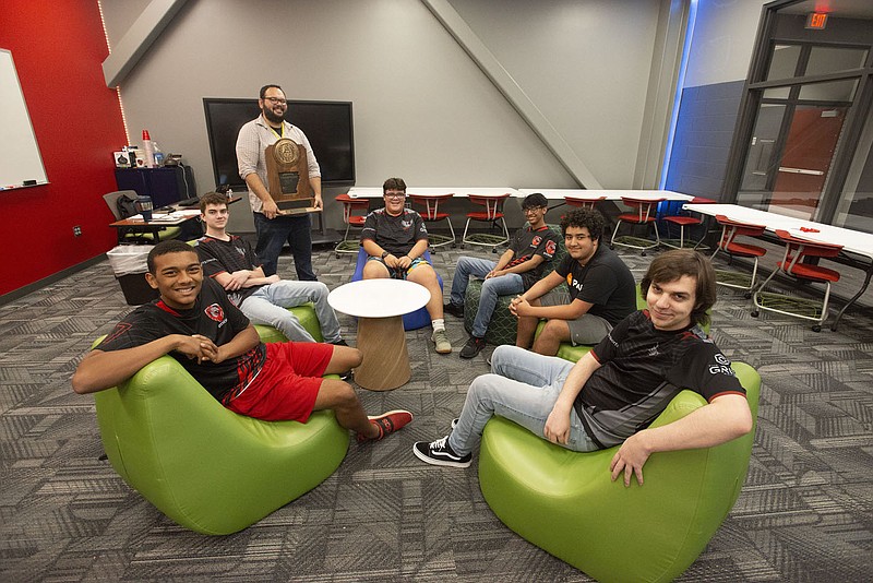 The Don Tyson School of InnovationsÃ¢â‚¬â„¢ esports team, from the left, Keith Harper, Drake Mayes, coach Burl Sniff, Michael Arriola, Andres Diaz, Andrew Moore and Anthony White are seen here Thursday Aug, 18, 2022. The team was named one of the top 10 in the nation by U.S.A. Today. Esports were recognized as an activity by the Arkansas Activities Association in 2019 and last year more than 151 teams in the state participated.  Visit nwaonline.com/220819Daily/ for today's photo gallery.  (NWA Democrat-Gazette/J.T. Wampler)