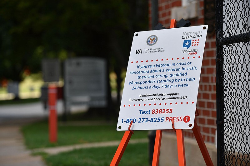 A sign offering assistance to veterans in crisis stands Wednesday, Aug. 10, 2022, at the entrance of the Veterans Health Care System of the Ozarks in Fayetteville. Visit nwaonline.com/220811Daily/ for today's photo gallery. 
(NWA Democrat-Gazette/Andy Shupe)
