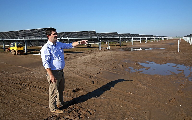 Lambert Marshall, with Bearskin Farms, looks over the operation's new solar farm set to go online as early as October near Kerr on Friday, August 19, 2022. (Arkansas Democrat-Gazette/Colin Murphey)