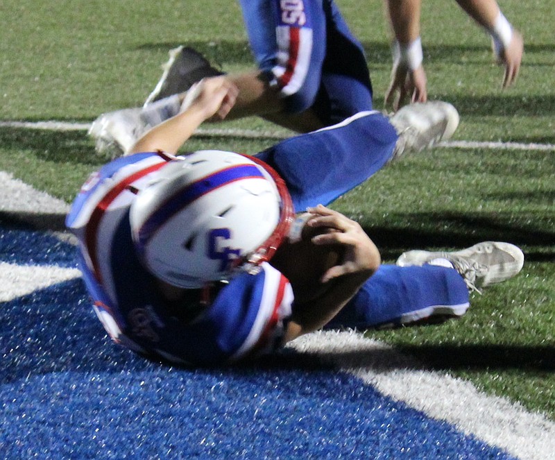 Sophomore running back Brooks Volkart dives into the end zone for a game-tying touchdown in the fourth quarter. (Democrat Photo/Evan Holmes)