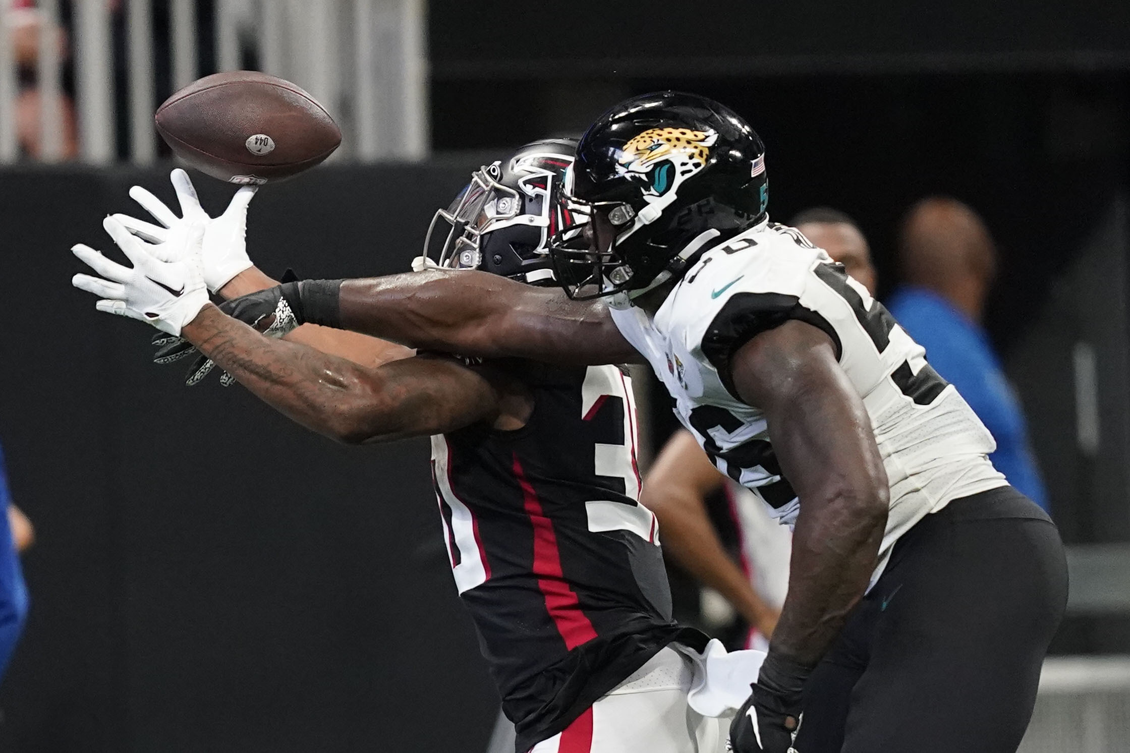 Atlanta Falcons cornerback Teez Tabor (20) runs onto the field before an  NFL football game against the Jacksonville Jaguars, Saturday, Aug. 27,  2022, in Atlanta. The Atlanta Falcons won 28-12. (AP Photo/Danny