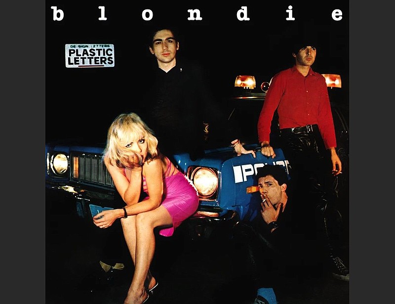 Blondie’s “Plastic Letters” album (1978) featured members of the band sitting on and around a police car, with Debbie Harry in a hot-pink mini as the focal point.