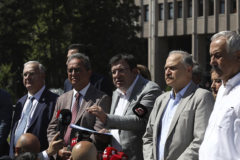 A group of lawmakers from Turkey's main opposition Republican People's Party, or CHP, speak to the media after they filed a legal complaint, in Ankara, Turkey, Monday, Aug. 29, 2022, demanding that prosecutors investigate allegations of corruption. A fugitive mafia boss-turned-whistleblower has accused a group of people, including a presidential advisor and a ruling party legislator, of demanding bribes from a businesswoman. (AP Photo/Burhan Ozbilici)