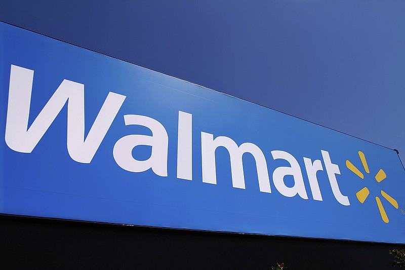 FILE - The Walmart logo is displayed on a store in Springfield, Ill., May 16, 2011. Walmart filed a motion on Monday, Aug. 29, 2022, to dismiss a lawsuit by the Federal Trade Commission in June that accused the nation's largest retailer of allowing its money transfer services to be used by scam artists, calling it an “egregious instance of agency overreach.” (AP Photo/Seth Perlman, File)
