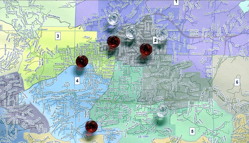 Push pins on a map at the Election Commission Building denote the location of the county’s 16 vote centers and six early voting locations. - Photo by Donald Cross of The Sentinel-Record