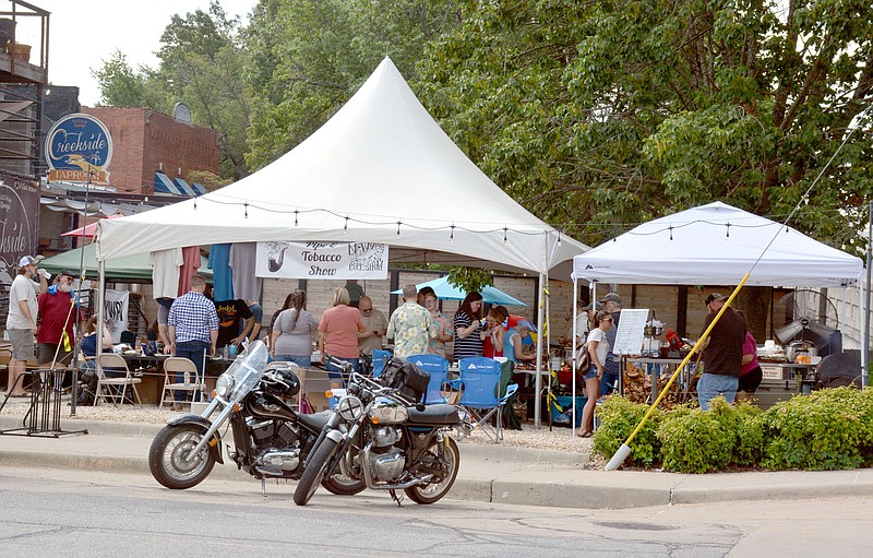 Marc Hayot/Herald-Leader Siloam Springs residents and visitors gathered on Saturday at Ash and Ember for the NWA Pipe and Tobacco Show. Jim Gibbens, the owner of Ash and Ember hosted multiple tobacco shows over the years but as the only pipe shop in Northwest Arkansas decided to incorporate the rest of the region for the show.