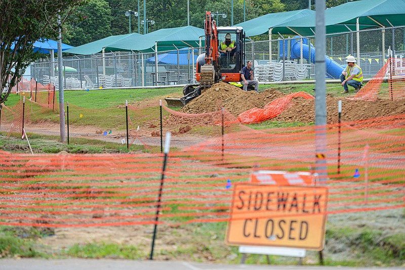 Workers gather on Thursday, Sept. 1, 2022, while performing construction to the sidewalk trail at Creekmore Park in Fort Smith. The undertaking is one of multiple extensive projects currently underway by the City of Fort Smith Parks and Recreation Department. Visit nwaonline.com/220904Daily/ for today's photo gallery.
(NWA Democrat-Gazette/Hank Layton)