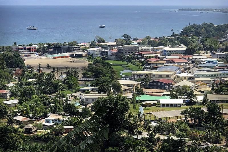 FILE - Ships are docked offshore in Honiara, the capital of the Solomon Islands, Nov. 24, 2018. The Solomon Islands government on Wednesday, Aug. 31, 2022, asked countries to not send naval vessels to the South Pacific nation until approval processes are overhauled. (AP Photo/Mark Schiefelbein, File)