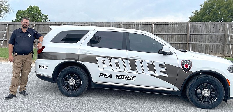 TIMES photograph by Annette Beard
Lt. John Langham shows one of the new police vehicles recently added to the department's fleet.