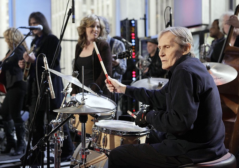 FILE - In this Oct. 9, 2009 file photo, Levon Helm, right, performs with his band on the "Imus in the Morning" program on the Fox Business channel, in New York. At center is his daughter Amy Helm. Helm, who was in the final stages of his battle with cancer, died Thursday, April 19, 2012 in New York.  He was 71.  He was a key member of The Band and lent his distinctive Southern voice to classics like "The Weight" and "The Night They Drove Old Dixie Down." (AP Photo/Richard Drew, file)