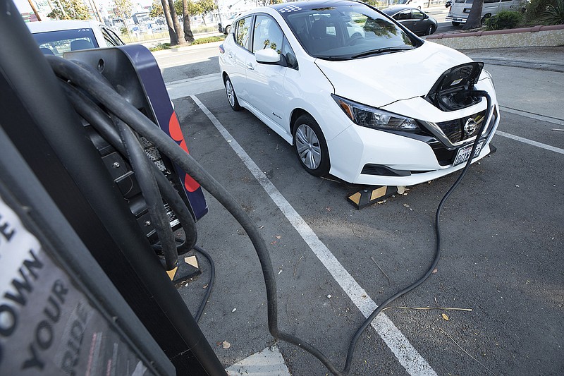 An electric car charges up in San Pedro, California, Thursday, Dec. 2, 2021. Under a new proposal from the California Air Resources Board, more than a third of new passenger cars and trucks sold in California in 2025 would have to be zero-emission vehicles. (Myung J. Chun/Los Angeles Times/TNS)