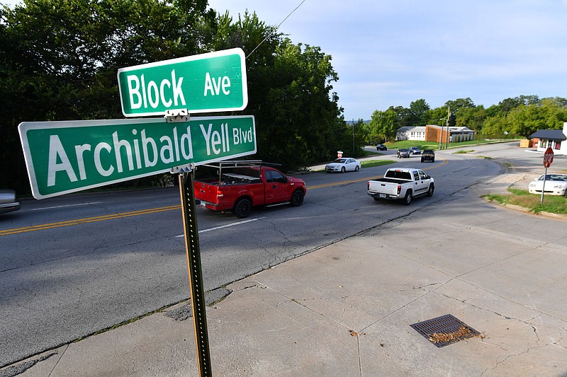 Traffic passes Thursday along Archibald Yell Boulevard past Block Avenue in Fayetteville. The City Council on Tuesday will consider renaming Archibald Yell Boulevard to Nelson Hackett Boulevard. Hackett escaped slavery to Canada in 1841, but was the first and only person extradited back to the United States, prompting the British government to make extradition of those fleeing slavery to Canada nearly impossible. Visit nwaonline.com/220904Daily/ for today's photo gallery. 
(NWA Democrat-Gazette/Andy Shupe)