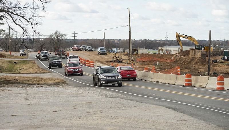 NWA Democrat-Gazette/BEN GOFF @NWABENGOFF
Cars pass by road construction Thursday, Dec. 20, 2018, on Arkansas Highway 265/Old Wire Road near the intersection with East Randall Wobbe Lane in Springdale.