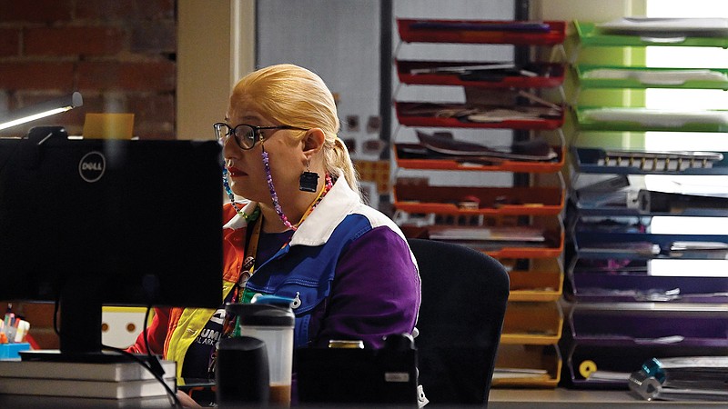 Jasmine Jobe, an editorial assistant, works on the new redesign of the online Encyclopedia of Arkansas at her desk in Little Rock on Friday, Sept. 2, 2022.

(Arkansas Democrat-Gazette/Stephen Swofford)