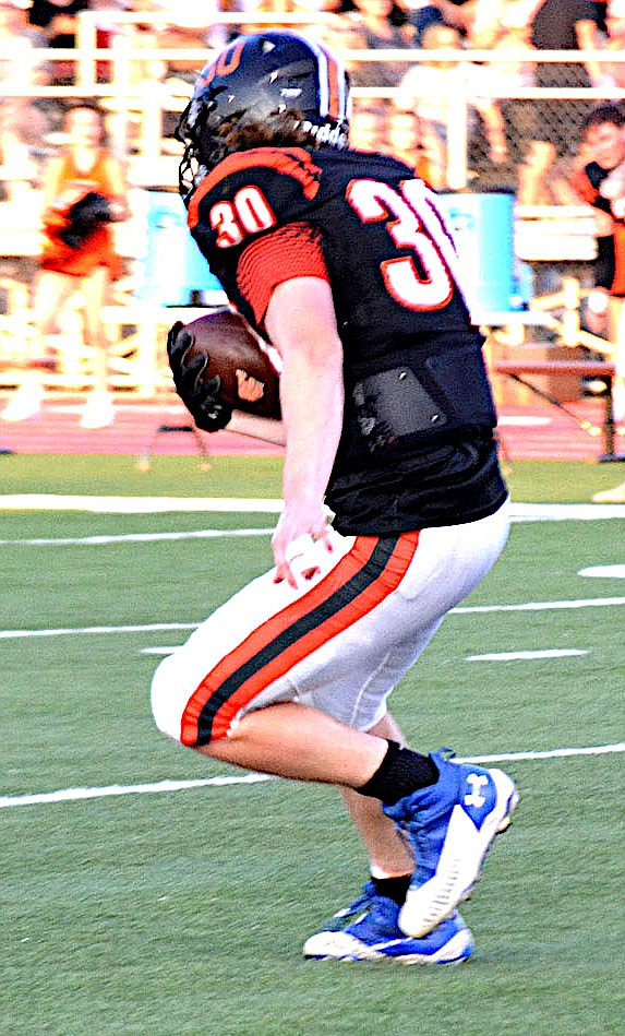 File Photo/ANNETTE BEARD
Gravette junior Kyler Austin carries the ball during play against Pea Ridge on Aug. 26.