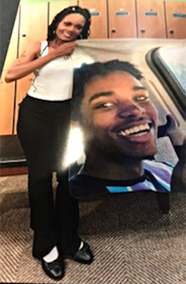 Sheerie Graves, of Texarkana, Texas, displays a large photo of her only son, Mecedric Monte "Buddy" McFadden, as a tribute to him. McFadden died in and automobile wreck earlier this year on U.S. Highway 67 near Fulton, Arkansas. Graves has formed a nonprofit charity in her son's memory. (Submitted photo)