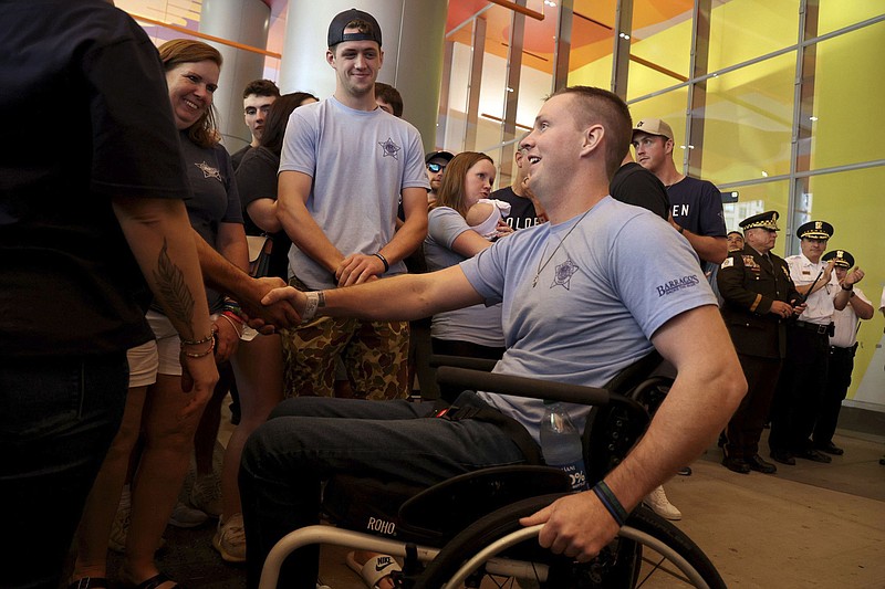 Family, friends support paralyzed Chicago police officer as he moves to  rehab