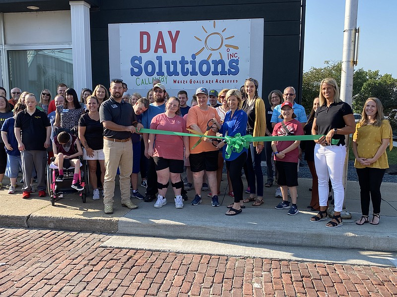 A crowd is gathered outside Day Solutions Callaway to cut the ribbon and celebrate the opening of the location. (Anakin Bush/Fulton Sun photo)