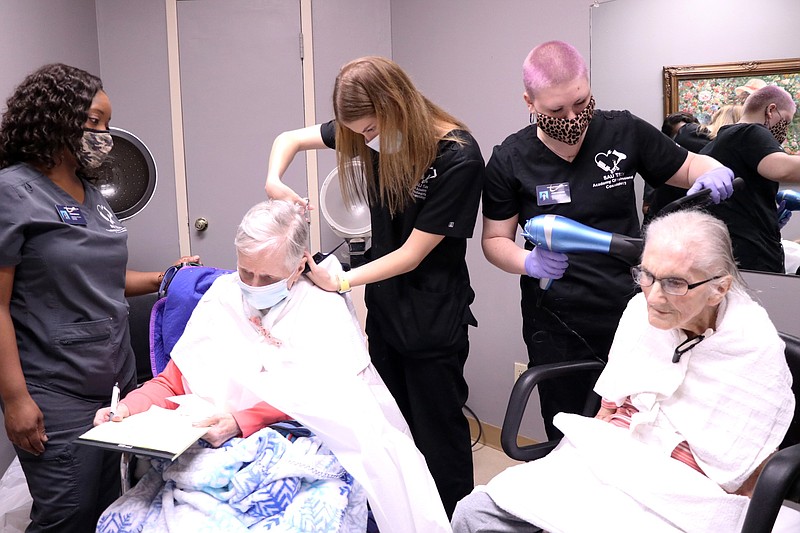 Courtesy Photo
The SAU Tech Academy of Professional Cosmetology has a new partnership with the Ouachita Nursing and Rehab Center and can be seen here giving haircuts to residents.