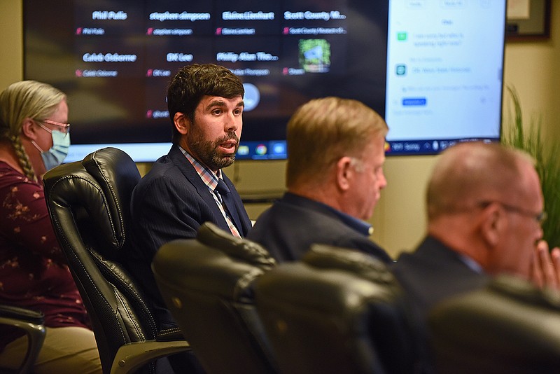 Colby Roe, an attorney representing the city of Fort Smith, discusses his request for a waiver to remove the Confederate flag from the historical Flags over Fort Smith display during the Arkansas History Commission meeting Thursday in Little Rock.
(Arkansas Democrat-Gazette/Staci Vandagriff)
