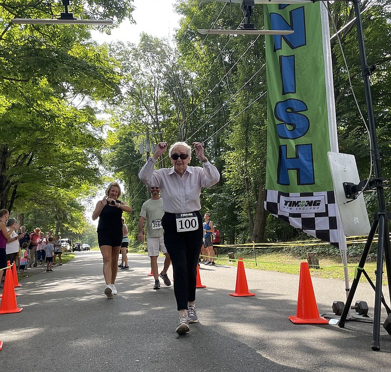 Marion "Mic" Roberts, wearing Bib No. 100, finishes the Haddam Neck Fair 5K road race Sunday morning in a little over an hour. Roberts turned 100 Aug. 28, 2022. 
(Lori Riley/Hartford Courant/TNS)
