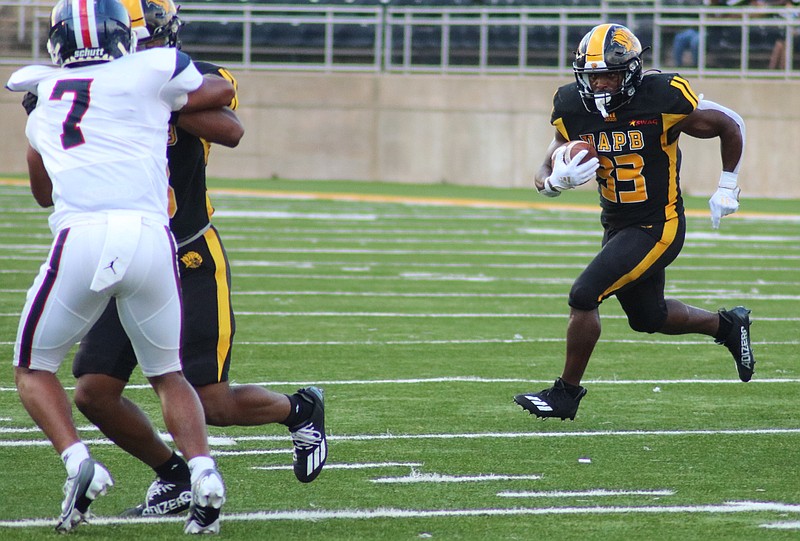 UAPB running back Kayvon Britten follows a block and finds an open hole during last Saturday's win over Lane College at Simmons Bank Field at Golden Lion Stadium. (Special to The Commercial/Jamie Hooks)