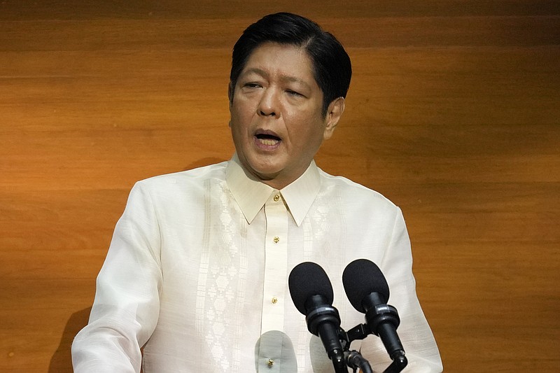 FILE - Philippine President Ferdinand Marcos Jr. delivers his first state of the nation address in, Quezon city, Philippines, Monday, July 25, 2022. Human rights activists in the Philippines rejected on Saturday, Sept. 10, 2022, Marcos Jr.’s move to proclaim the birthday of his late father, an ousted dictator, a special holiday in their northern home province. (AP Photo/Aaron Favila, Pool, File)