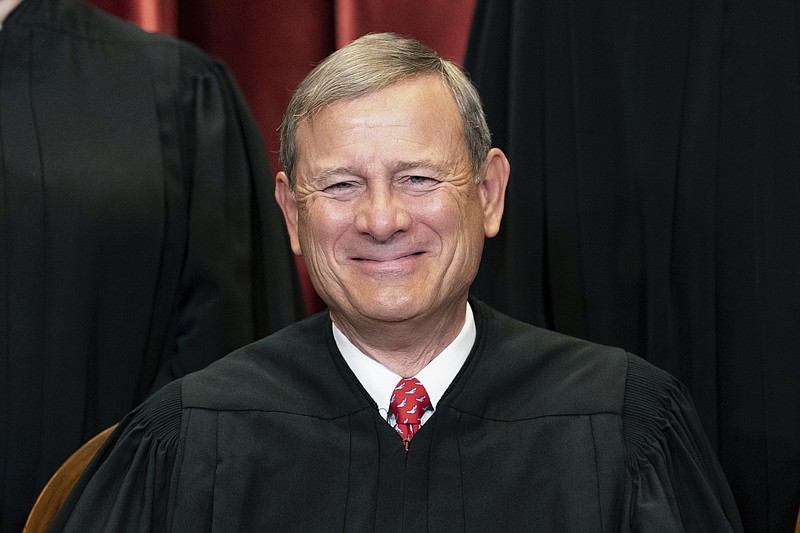 FILE - Chief Justice John Roberts sits during a group photo at the Supreme Court in Washington, April 23, 2021. Roberts is set to make his first public appearance since the U.S. Supreme Court overturned Roe v. Wade, speaking Friday night, Sept. 9, 2022, at a judicial conference in Colorado.(Erin Schaff/The New York Times via AP, Pool, File)