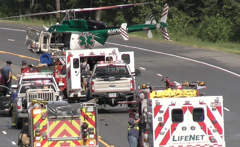 All four travel lanes of U.S. Highway 70 east were shut down Saturday afternoon after a multi-vehicle wreck involving "multiple fatalities" that occurred at around 2:15 p.m. about 2.2 miles east of the King Expressway. - Photo by Lance Porter of The Sentinel-Record