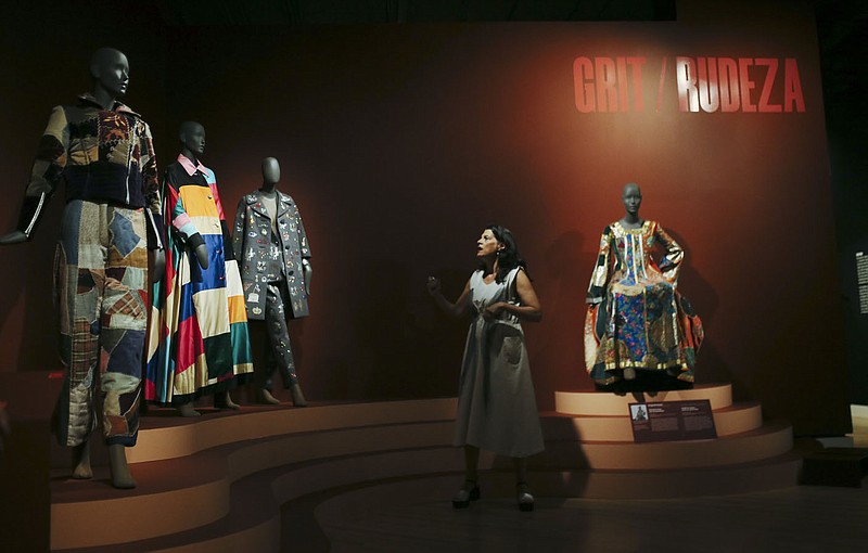 Guest curator Michelle Tolini Finamore wanted an exhibit that featured some of the lesser known names influential to American fashion. She discussed these patchwork dresses Sept. 8 during a media preview at Crystal Bridges Museum of American Art in Bentonville.

(NWA Democrat-Gazette/Charlie Kaijo)