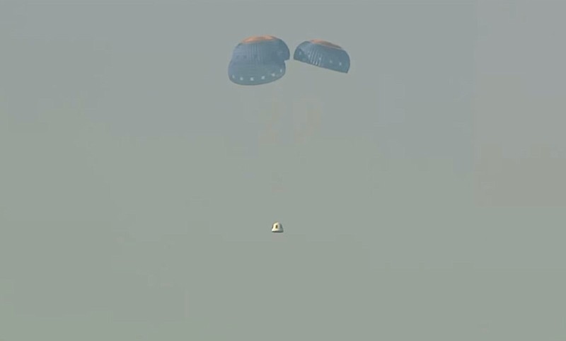This image provided by Blue Origin shows a capsule containing science experiments after a launch failure, parachuting onto the desert floor on Monday, Sept. 12, 2022. Jeff Bezos' rocket company has suffered its first launch failure. No one was aboard, only science experiments. The Blue Origin rocket veered off course over West Texas about 1 1/2 minutes after liftoff Monday. (Blue Origin via AP)