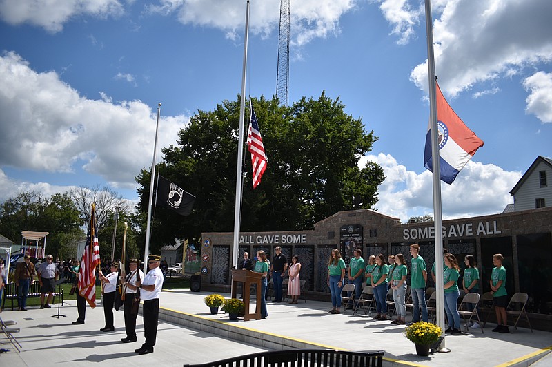 Democrat photo/Garrett Fuller — Members of the California Veterans of Foreign Wars (VFW) present the colors Sunday (Sept. 11, 2022,) at the "Honoring Our Local Heroes" event hosted by the Moniteau County 4-H Day of Service Committee at Latham Memorial Park in California.